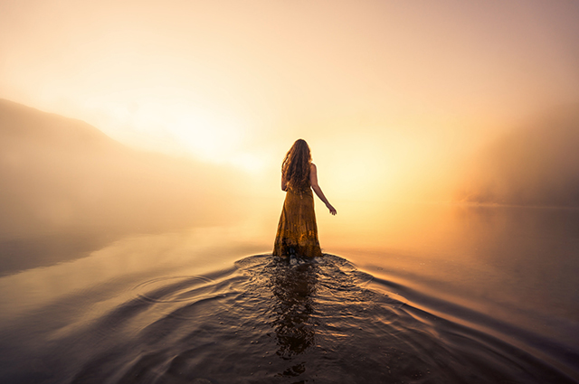 Woman walking towards the light